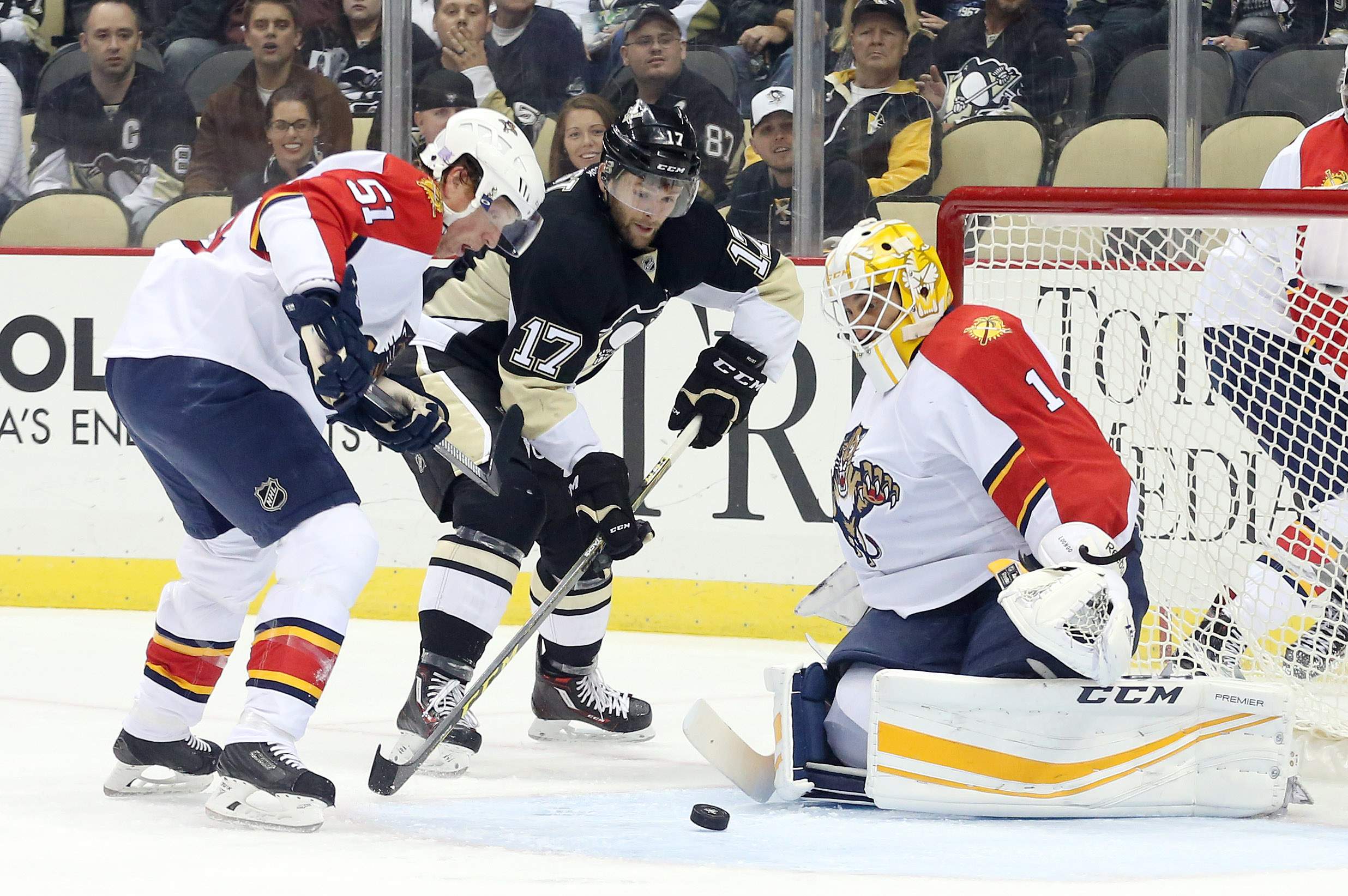 Oct 20, 2015; Pittsburgh, PA, USA; Florida Panthers goalie Roberto Luongo (1) makes a save against Pittsburgh Penguins right wing Bryan Rust (17) as defenseman Brian Campbell (51) depends during the first period at the CONSOL Energy Center. Mandatory Credit: Charles LeClaire-USA TODAY Sports