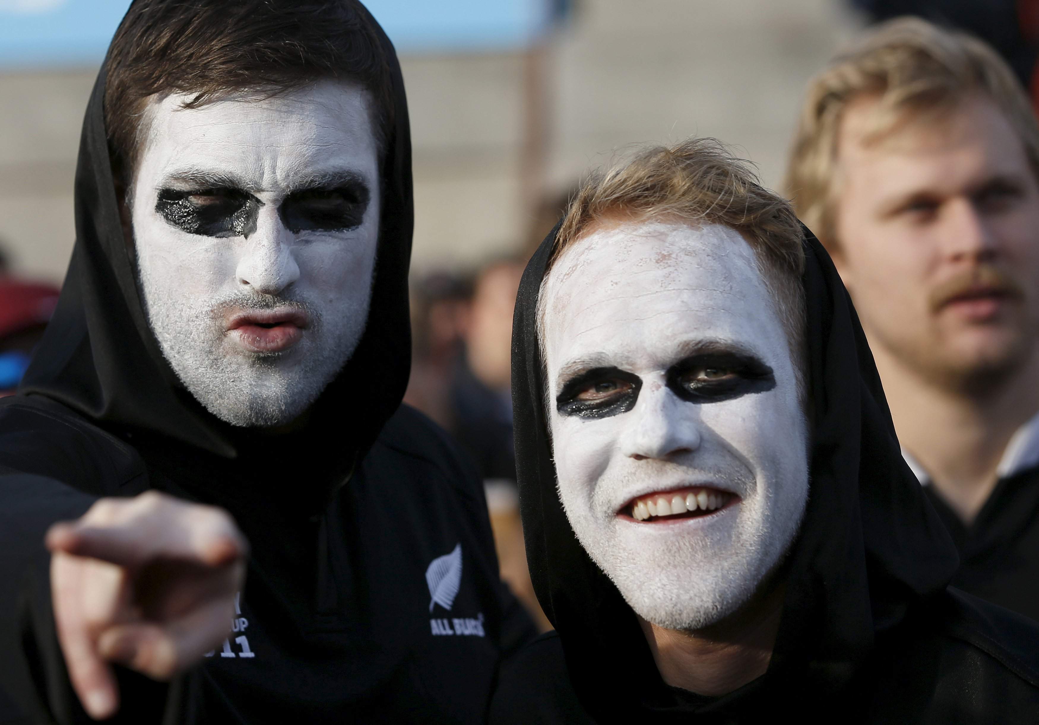 'All Blacks' rugby fans in face-paint are pictured before a showing of the Rugby World Cup final in a fan-zone in Trafalgar Square, London, Britain, October 31, 2015.  REUTERS/Peter Nicholls