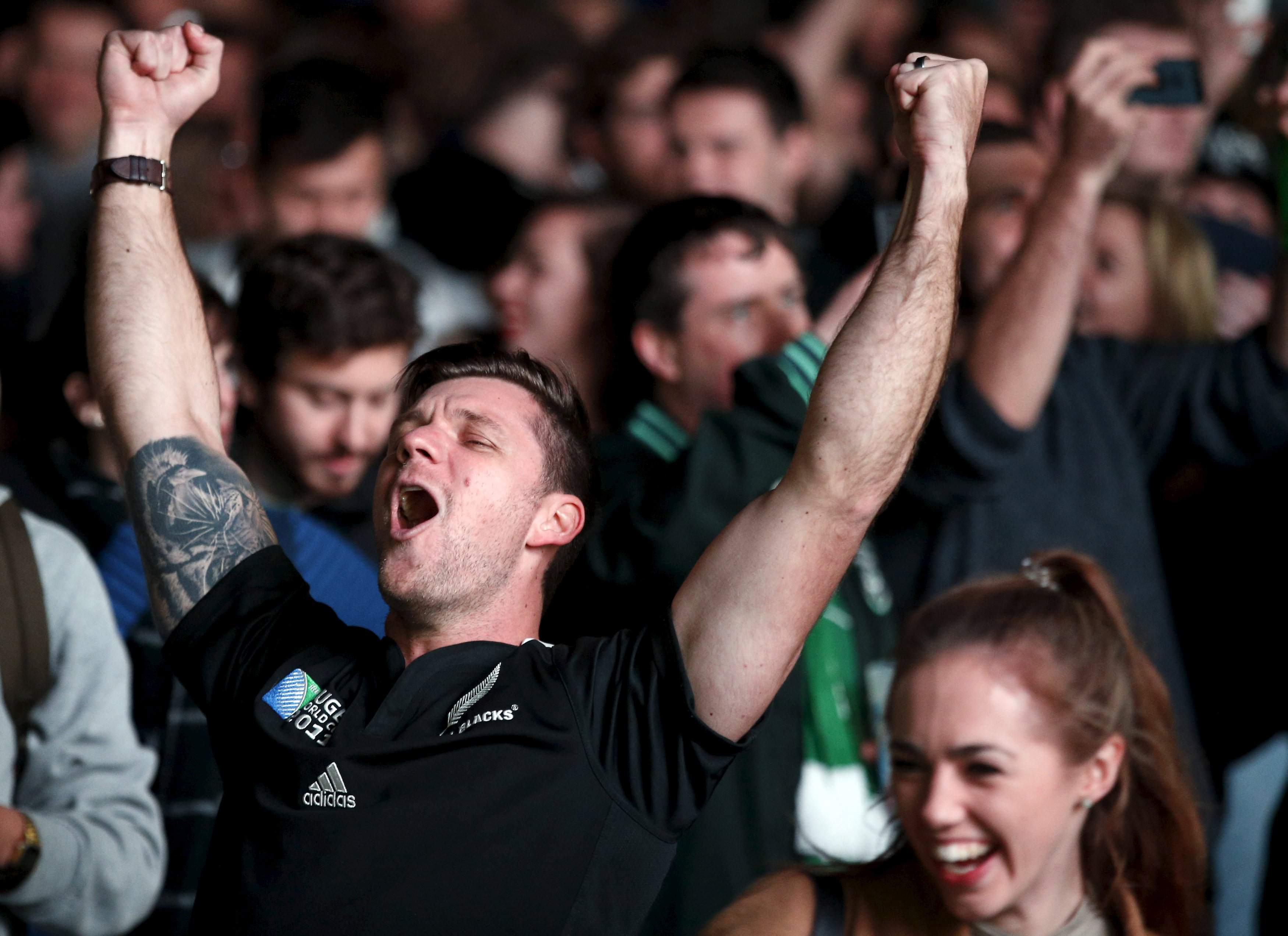 New Zealand All Blacks rugby fans celebrate their Rugby World Cup final win against Australia's Wallabies at a fan-zone in Trafalgar Square, in London, Britain, October 31, 2015.  REUTERS/Peter Nicholls   Picture Supplied by Action Images