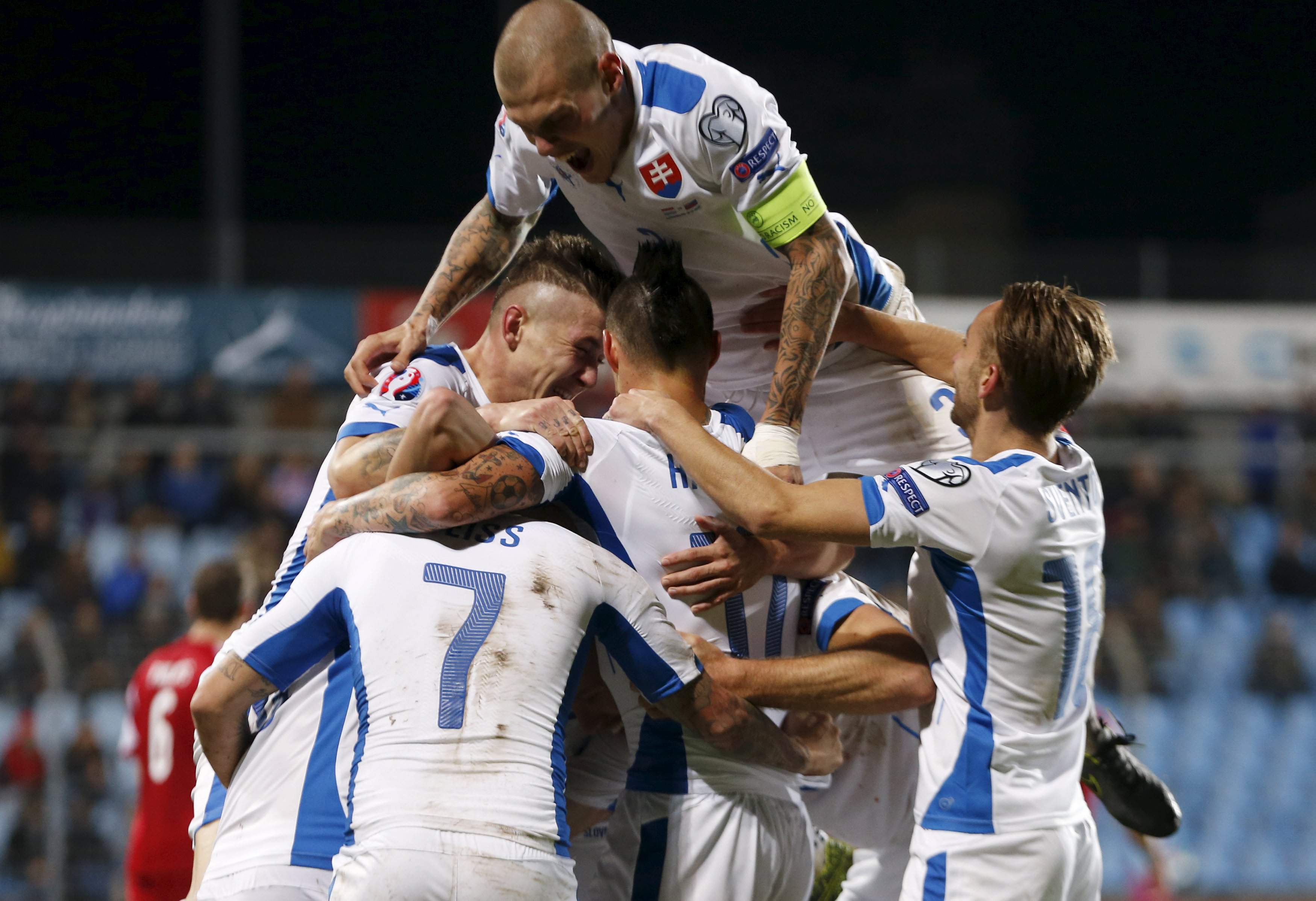 Slovakia's players celebrate after Robert Mak (unseen) scored against Luxembourg during their Euro 2016 group C qualification match at the Josy Barthel stadium in Luxembourg, October 12, 2015.  REUTERS/Francois Lenoir