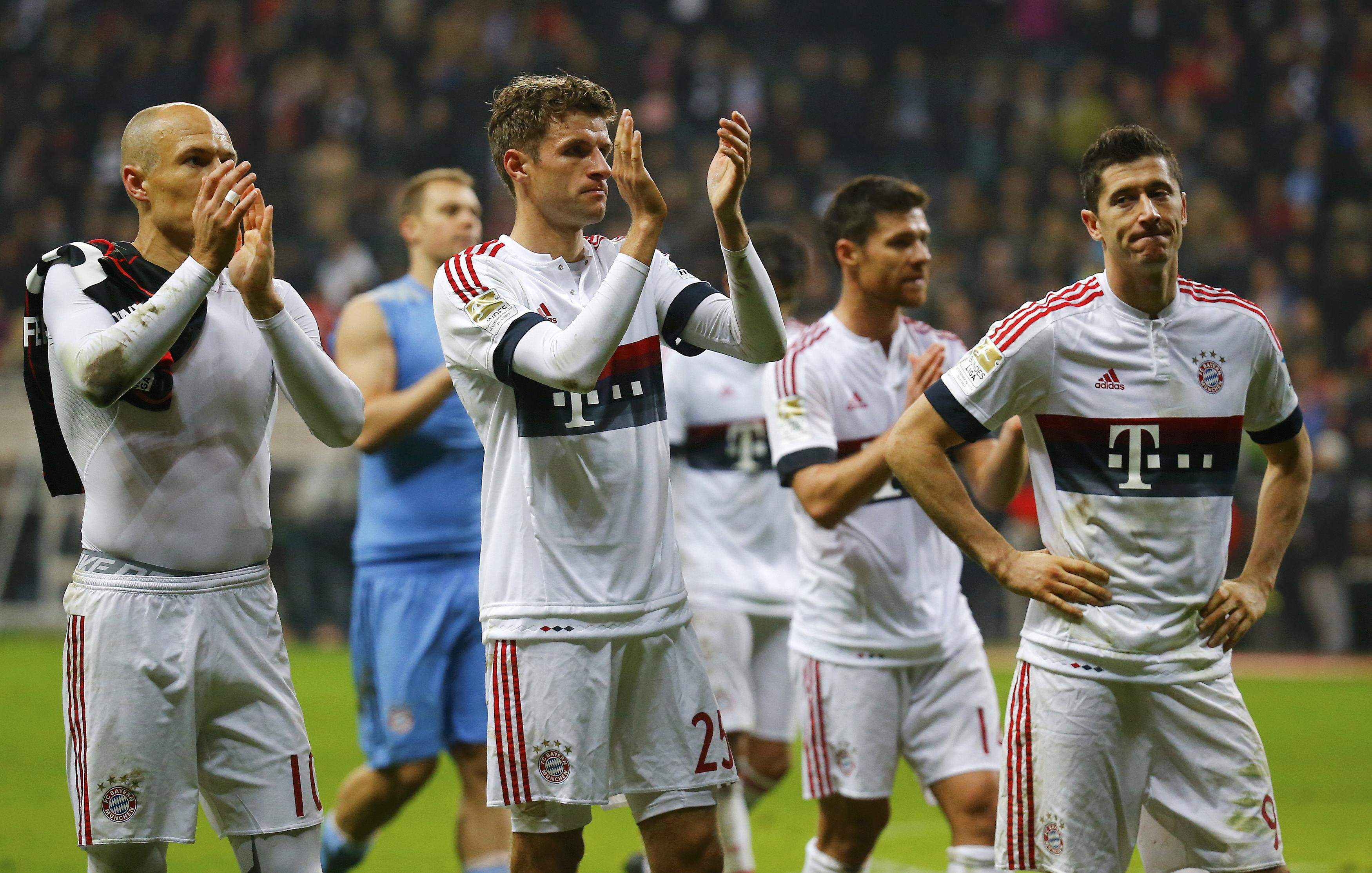 Bayern Munich's Arjen Robben, Thomas Mueller and Robert Lewandowski (L-R) react after their German first division Bundesliga soccer match in Frankfurt, Germany, October 30, 2015. REUTERS/Kai Pfaffenbach DFL RULES TO LIMIT THE ONLINE USAGE DURING MATCH TIME TO 15 PICTURES PER GAME. IMAGE SEQUENCES TO SIMULATE VIDEO IS NOT ALLOWED AT ANY TIME. FOR FURTHER QUERIES PLEASE CONTACT DFL DIRECTLY AT + 49 69 650050