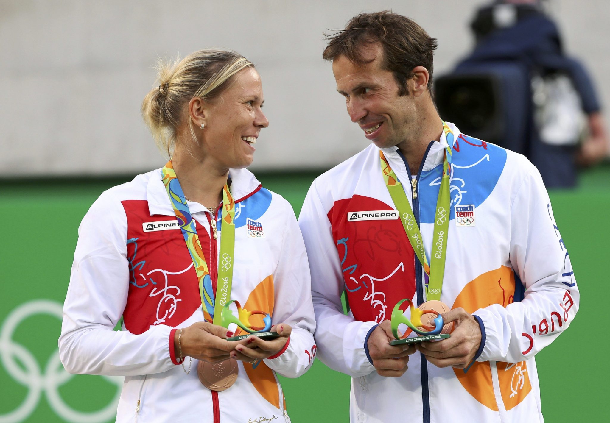 2016 Rio Olympics - Tennis - Victory Ceremony - Mixed Doubles Victory Ceremony - Olympic Tennis Centre - Rio de Janeiro, Brazil - 14/08/2016. Bronze medalists Radek Stepanek (CZE) of Czech Republic and Lucie Hradecka (CZE) of Czech Republic react after receiving their medals. REUTERS/Kevin Lamarque  FOR EDITORIAL USE ONLY. NOT FOR SALE FOR MARKETING OR ADVERTISING CAMPAIGNS.