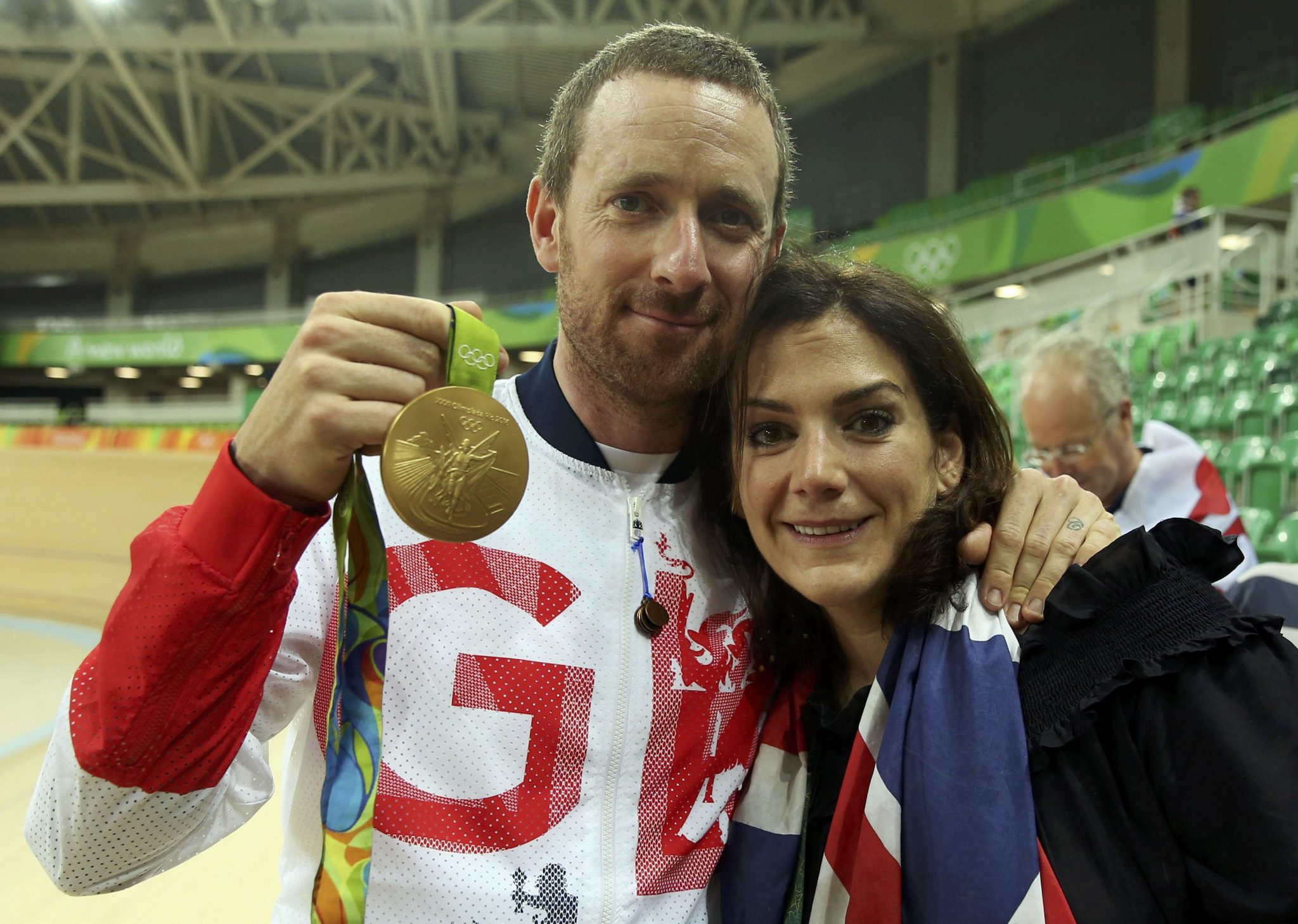 2016 Rio Olympics - Cycling Track - Victory Ceremony - Men's Team Pursuit Victory Ceremony - Rio Olympic Velodrome - Rio de Janeiro, Brazil - 12/08/2016. Bradley Wiggins (GBR) of Britain holds his gold medal and poses with his wife Catherine. REUTERS/Matthew Childs FOR EDITORIAL USE ONLY. NOT FOR SALE FOR MARKETING OR ADVERTISING CAMPAIGNS.